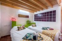 Postel nebo postele na pokoji v ubytování Casa Drago - Villa Perenquén