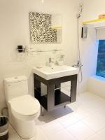 a bathroom with a white toilet and a sink at RF Hotel - Zhongxiao in Taipei