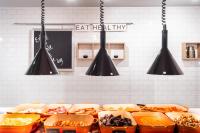 a kitchen with many containers of food and lights at Holiday Inn Leicester City by IHG in Leicester