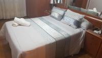Posteľ alebo postele v izbe v ubytovaní Apartamentos Quien Anda Ahí Ribadeo