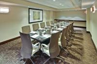 a conference room with a long table and chairs at Crowne Plaza Chicago O'Hare Hotel & Conference Center by IHG in Rosemont