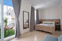Posteľ alebo postele v izbe v ubytovaní Sweet Sevilla Suites