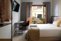 Posteľ alebo postele v izbe v ubytovaní Sweet Sevilla Suites