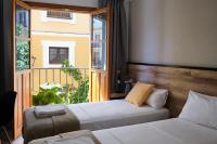 Posteľ alebo postele v izbe v ubytovaní Sweet Sevilla Suites