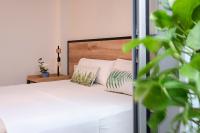 Posteľ alebo postele v izbe v ubytovaní Sweet Sevilla Suites