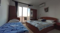 Posteľ alebo postele v izbe v ubytovaní Guesthouse Podaca