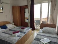 Posteľ alebo postele v izbe v ubytovaní Guesthouse Podaca