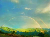 twobows in the sky over a mountain range at Alishan Tea Garden B&amp;B in Fenqihu