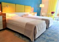 Posteľ alebo postele v izbe v ubytovaní Green Garden Hotel