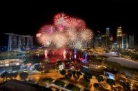 a fireworks display in a city at night at PARKROYAL COLLECTION Marina Bay, Singapore in Singapore