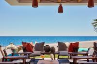 a beach with chairs and the ocean in the background at Atlantica Dreams Resort in Gennadi