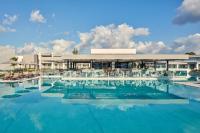 a large swimming pool with a building in the background at Atlantica Dreams Resort in Gennadi