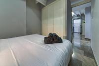 A bed or beds in a room at H2Granada en Centro Terraza-solarium & Parking