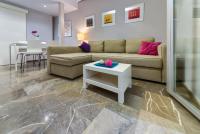 A seating area at H2Granada en Centro Terraza-solarium & Parking