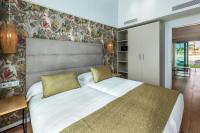 Postel nebo postele na pokoji v ubytování Kumara Serenoa By Lopesan Hotels
