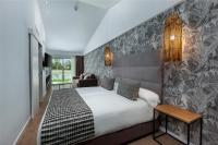 Postel nebo postele na pokoji v ubytování Kumara Serenoa By Lopesan Hotels
