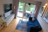 Televízia a/alebo spoločenská miestnosť v ubytovaní Blue Velvet Premium Apartments III