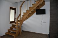 Televízia a/alebo spoločenská miestnosť v ubytovaní Pod Nartami