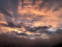 a cloudy sky with the sun poking through at Bliss Bed and Breakfast in Yuchi