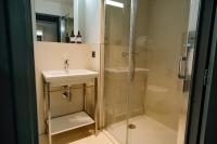 a bathroom with a sink and a shower at Live Hotels Bordeaux Lac in Bordeaux