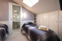 A bed or beds in a room at La Cava dei Sogni
