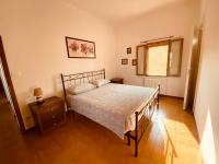 A bed or beds in a room at B&B Villino Margherita