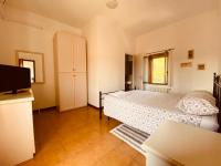 A bed or beds in a room at B&B Villino Margherita