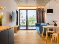 Televízia a/alebo spoločenská miestnosť v ubytovaní Villa Verdi Pleasure & Spa