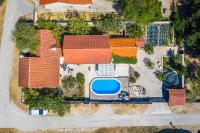 an overhead view of a house with a swimming pool at Holiday Home Rosko in Skradin