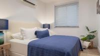 A bed or beds in a room at Ada Dreams City