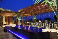 a bar in a restaurant at night with lights at Four Seasons Hotel in Limassol