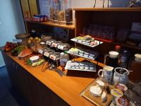a buffet with food and drinks on a counter at Hotel Am Hohen Schwarm in Saalfeld