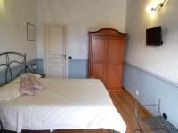 Łóżko lub łóżka w pokoju w obiekcie La Locanda di San Biagio