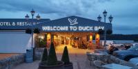 a welcome to duck bay restaurant at night at Duck Bay Hotel & Restaurant in Balloch
