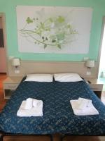 Posteľ alebo postele v izbe v ubytovaní 21 Aprile Accommodation