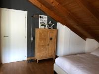 Posteľ alebo postele v izbe v ubytovaní Trento City Loft