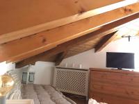 Televízia a/alebo spoločenská miestnosť v ubytovaní Trento City Loft