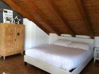 Posteľ alebo postele v izbe v ubytovaní Trento City Loft