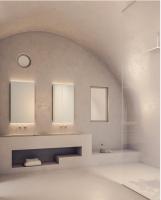 a bathroom with two sinks and two mirrors at Aspaki by Art Maisons in Oia