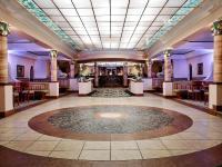 a large room with a lobby with a table at Hotel Pichlmayrgut in Schladming