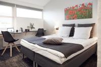 Postel nebo postele na pokoji v ubytování HORISONT Hotel & Konference