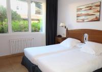 Postel nebo postele na pokoji v ubytování Hotel Gudamendi
