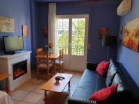 Telewizja i/lub zestaw kina domowego w obiekcie Apartamentos Dana Madrid
