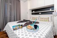 Łóżko lub łóżka w pokoju w obiekcie Nel Centro City Apartment