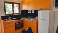 Kuchyň nebo kuchyňský kout v ubytování Apartments Gajo