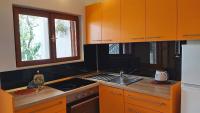 Kuchyň nebo kuchyňský kout v ubytování Apartments Gajo