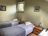 Posteľ alebo postele v izbe v ubytovaní APARTAMENTY-STUDIO noclegi wczasy wakacje ferie - pobyty rodzinne