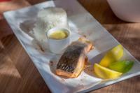 a plate of food with a piece of fish and lemon slices at Campanile Tours Sud - Chambray-Les-Tours in Chambray-lès-Tours
