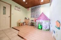 a childs room with a play area with a pink tent at Starhome Cottage in Ren&#39;ai
