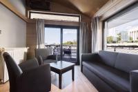 A seating area at Vogue Boat Apartments